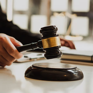 A judge's gavel resting on a wooden table, symbolizing authority and justice in Constitutional Law. - Alex Kincaid Law
