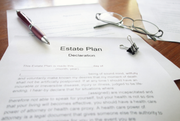 Attorney reviewing estate plan documents for a fiduciary change